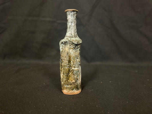 Bottle/Vase thin with long neck speckled Raku style signed by artist